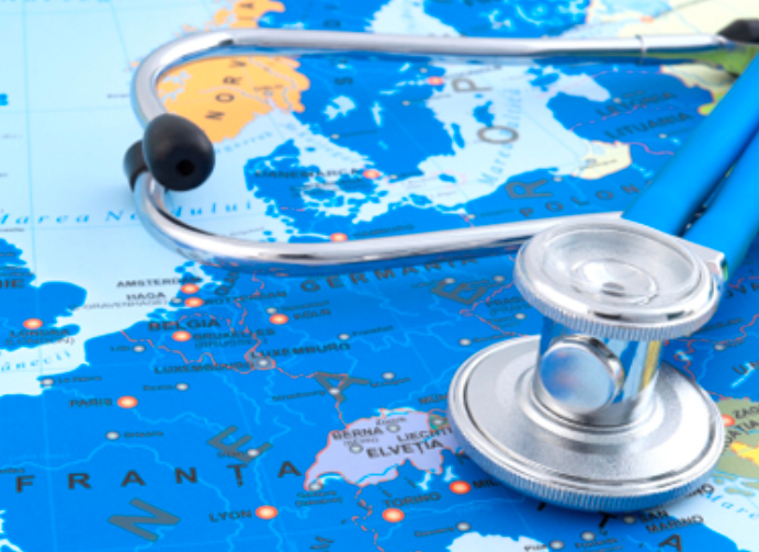 A stethoscope laying on a world map